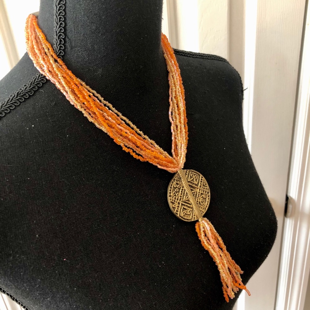 Orange and gold beaded pendant necklace